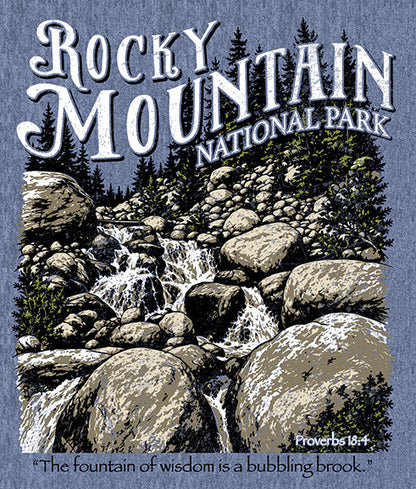 Rocky Mountain National Park t-shirt design mockup on a heathered blue fabric background, featuring a large scenic print and two smaller views of the front and back of a heathered blue crewneck t-shirt with the park logo.